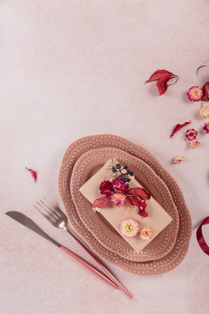 Process of decorating festive autumn table setting with dried flowersの写真素材