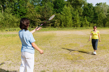 Playing Badminton in Natureの写真素材