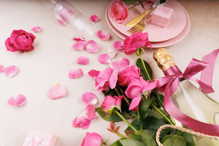 Elegant celebration with pink roses and champagne bottleの写真素材