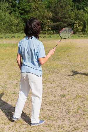 Man Preparing to Serve in Badmintonの写真素材