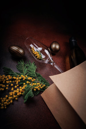 Easter festive setting with champagne and mimosa bouquetの写真素材