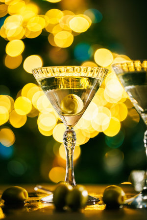Martini with olive in a festive atmosphereの写真素材