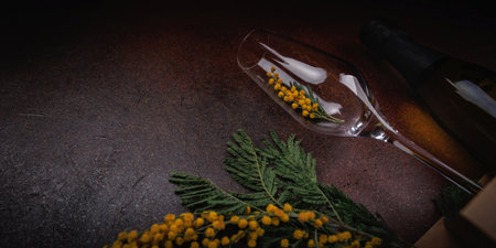 Festive Spring Flatlay banner with Wine and Yellow Flowersの写真素材