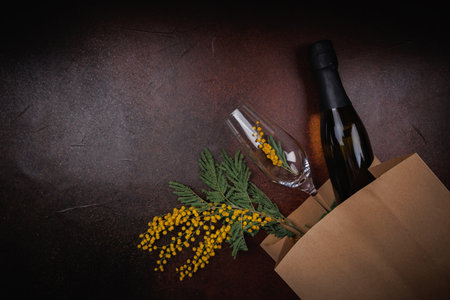 Spring Holiday Delivery with Champagne and Mimosa Flowersの写真素材