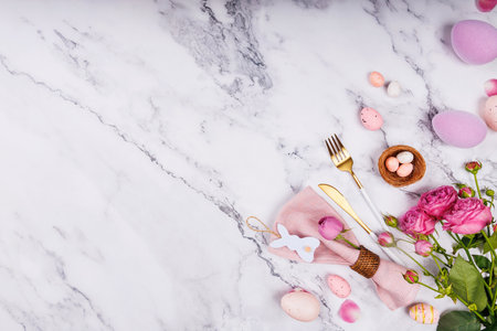 Easter Table Setting with Pink Napkin and Flowersの写真素材