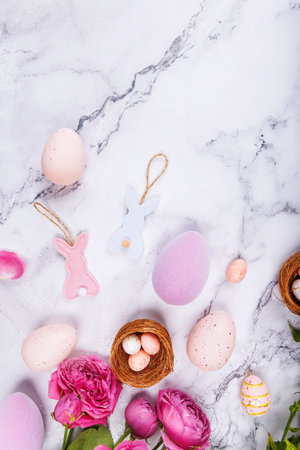 Easter Eggs and Bunny Ornaments with Pink Rosesの写真素材