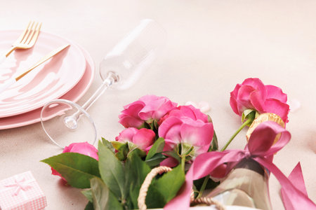 Beautiful romantic arrangement with champagne and rosesの写真素材