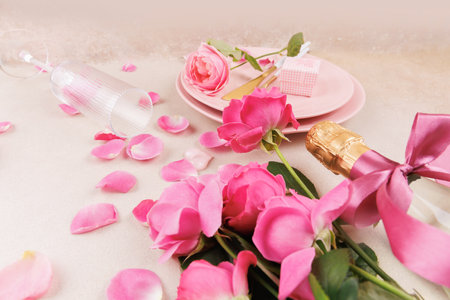 Valentines Day table setting with champagne and rosesの写真素材