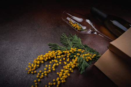 Yellow Flowers and Wine in Minimal Eco Settingの写真素材
