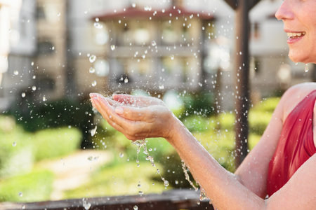 Outdoor Water Therapy with Hands in Focusの写真素材