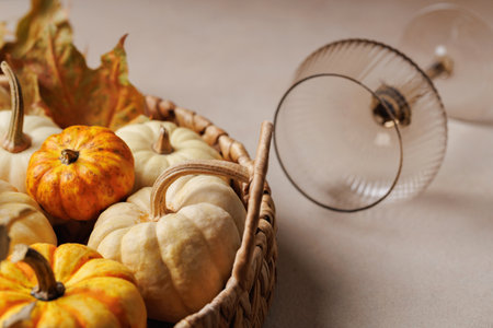Rustic autumn basket with pumpkins and glass decor..