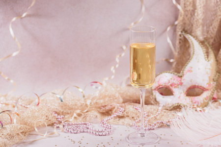 Masquerade ball holiday background with sparkling wineの写真素材