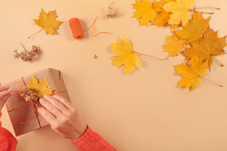 Process of wrapping and decorating presents with dried leaves