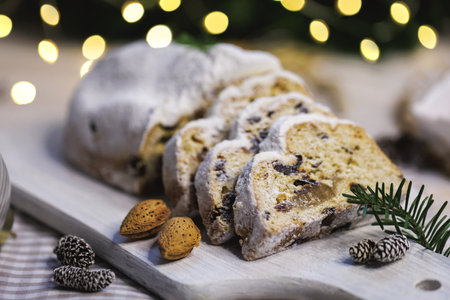 Festive stollen cake with almonds and Christmas decorの写真素材