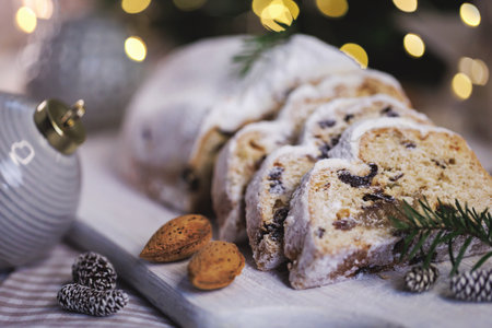 Festive stollen bread with almonds and evergreen branches