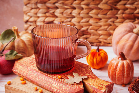 Close-Up of Herbal Tea in Glass Cup with Mini Pumpkinsの写真素材