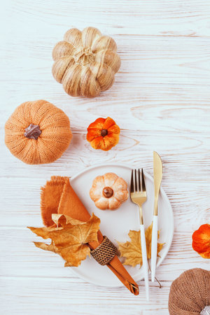 Autumn Table Setting with Cutlery and Pumpkin Decorの写真素材
