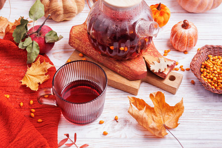 Thanksgiving Still Life with Tea, Leaves and Appleの写真素材