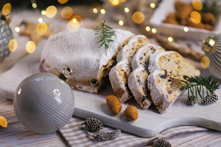 Holiday Stollen with Almonds on Wooden Boardの写真素材