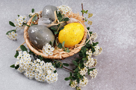 Easter egg spring composition with blossom branches