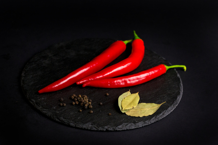 chili pepper, black pepper and bay leafの写真素材