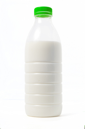 Plastic bottle of milk with a colored cap, white background, isoの写真素材