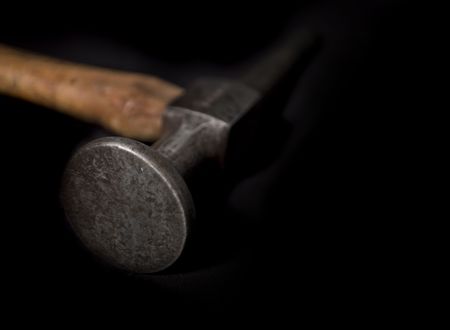 VINTAGE AUTO BODYWORK HAMMER ISOLATED ON BLACK BACKGROUND