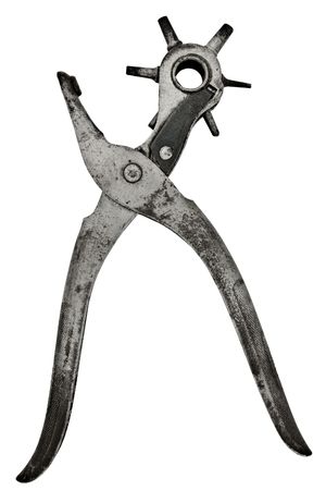 vintage revolver buckle tongue punch isolated on whiteの写真素材