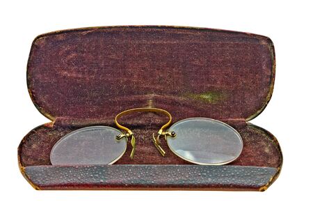 vintage pince nez in leather case isolated over white backgroundの写真素材