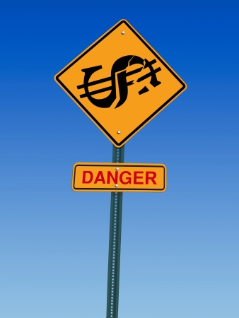 conceptual sign with dollar symbol and danger warning over blue skyの写真素材