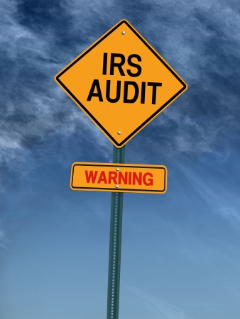 warning irs audit conceptual road sign over skyの写真素材