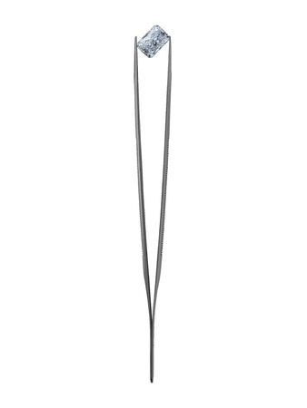 diamond in vintage jeweler tweezer over whiteの写真素材