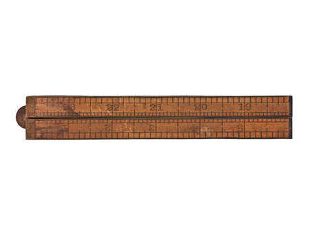 vintage boxwood and brass ruler over whiteの写真素材