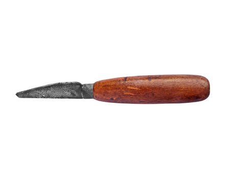 vintage rusty shoemaker knife over white