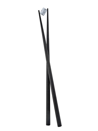 black chopsticks with radiant diamond over whiteの写真素材