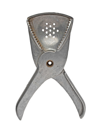 vintage aluminum lemon juicer over whiteの写真素材