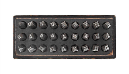 vintage metal lettering stamps punch set in a wooden box, clipping pathの写真素材
