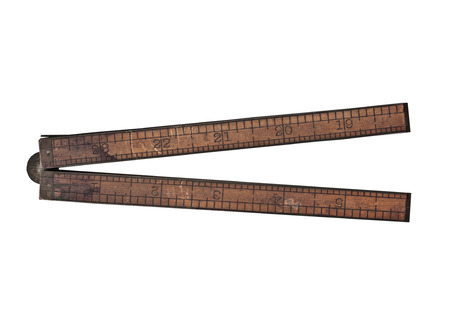 vintage boxwood and brass ruler over white, clipping pathの写真素材