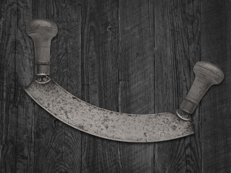 monochromatic image of a vintage french style herb chopper on old wooden tableの写真素材