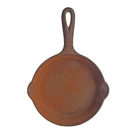 vintage rusty cast iron skillet over white, clipping pathの写真素材