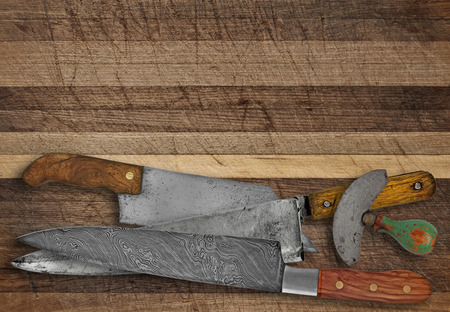 vintage kitchen knives over cutting board, space for your textの写真素材