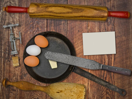 vintage utensils set, skillet, eggs,butter, space for your text on a blank business cardの写真素材