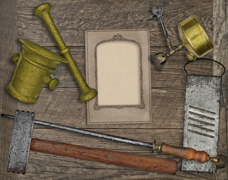 vintage kitchen utensils over wooden board, blank card for your textの写真素材