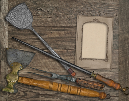 vintage kitchen utensils over wooden board, blank card for your textの写真素材