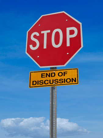 conceptual road sign stop, end of discussion over blue skyの写真素材