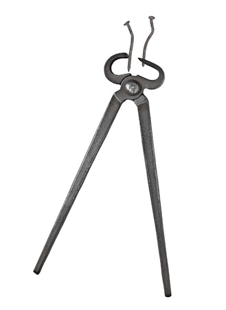 old vintage blacksmith pincers and nails  isolated over white background, clipping pathの写真素材
