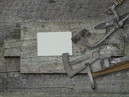 vintage jeweler tools and diamond over wooden bench, blank card for your businessの写真素材
