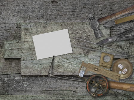 vintage jeweler tools and diamonds over wooden bench, blank card for your businessの写真素材