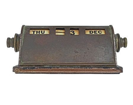 vintage rusty brass perpetual calendar over whiteの写真素材