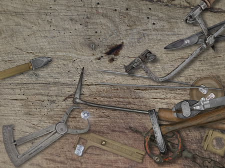 vintage jeweler tools and diamonds over wooden bench, space for your business nameの写真素材